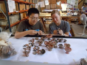 Kirsten and AJ expertizing the pottery