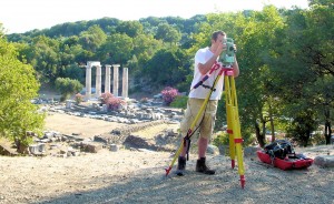 Zach using the total station with the Hieron in the background.